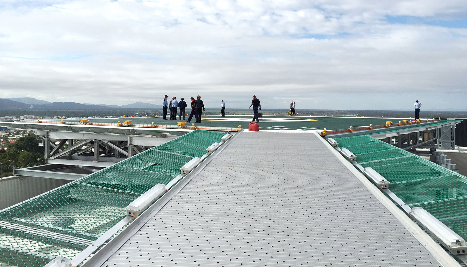 suspended walkway with safety net, link from Rockhampton Hospital helipad to lift lobby